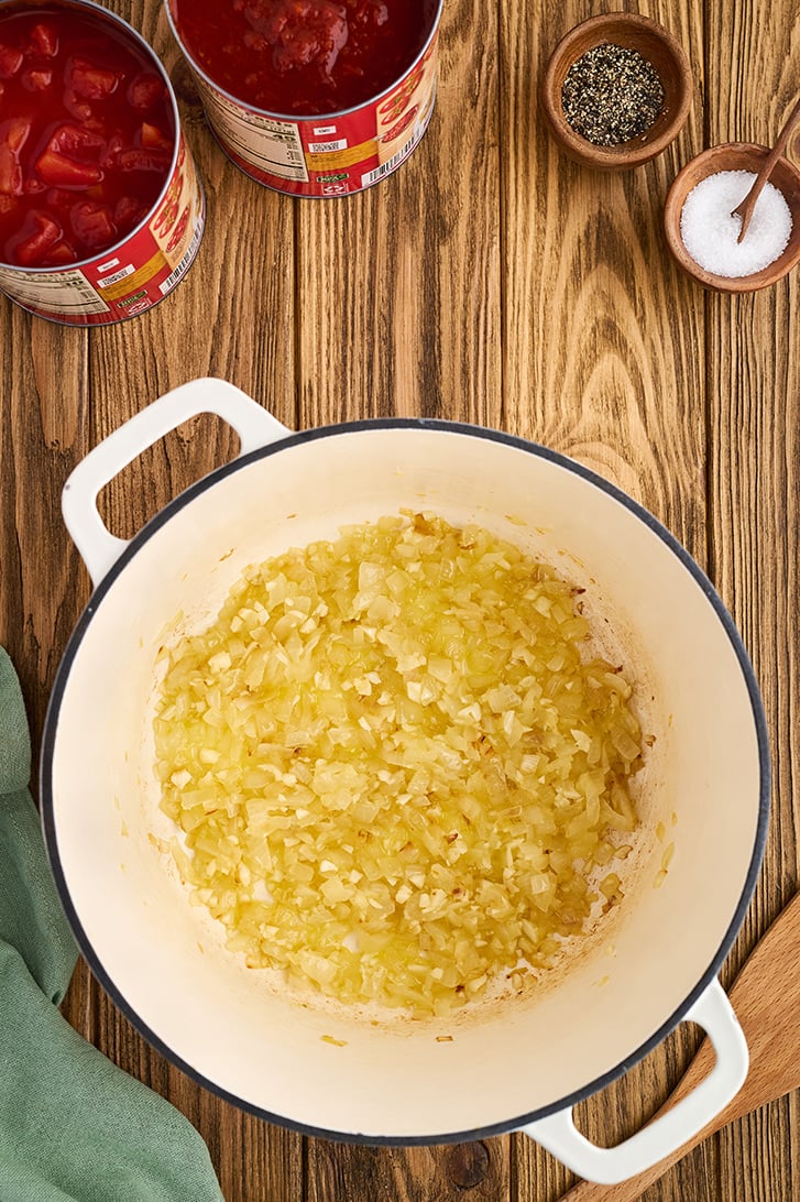 Onions and garlic in a white pot.