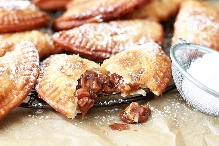 Deep Fried Pecan Pies on cooling rack.
