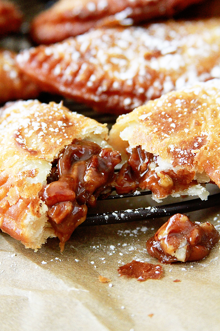Deep Fried Pecan Pies on cooling rack.