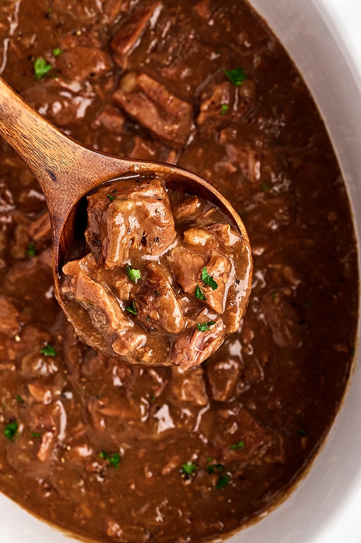 Scoop of Slow Cooker Beef Tips and Rice.