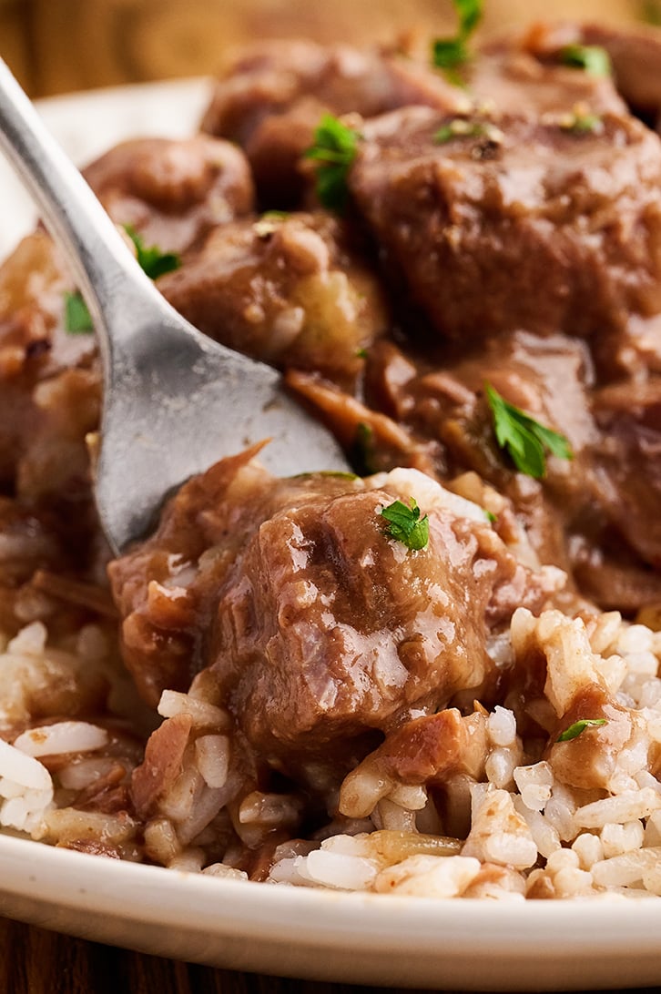 Forkful of Slow Cooker Beef Tips and Rice.