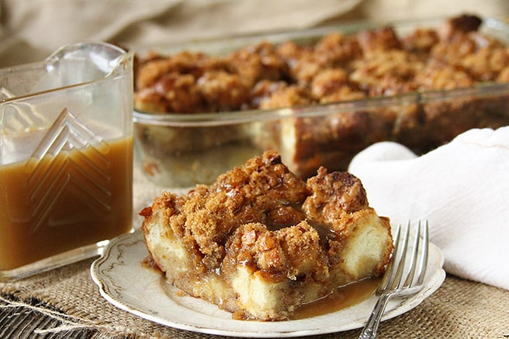 Slice of bread pudding with caramel sauce.