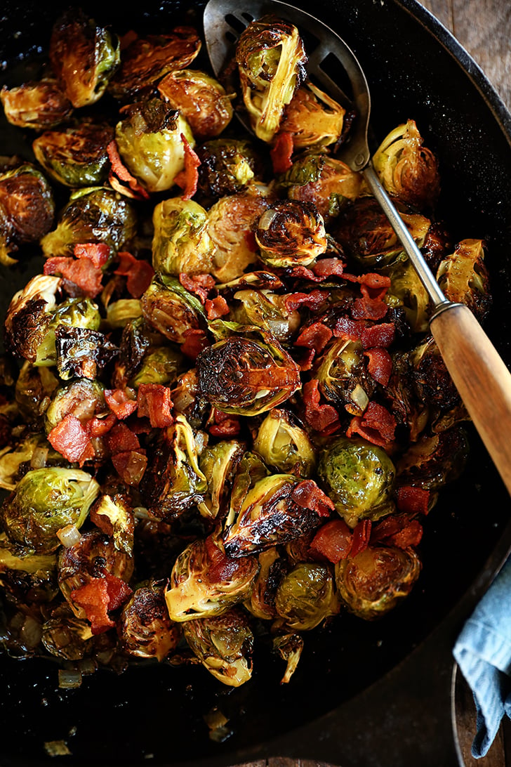 roasted Brussels sprouts with bacon in cast iron skillet.