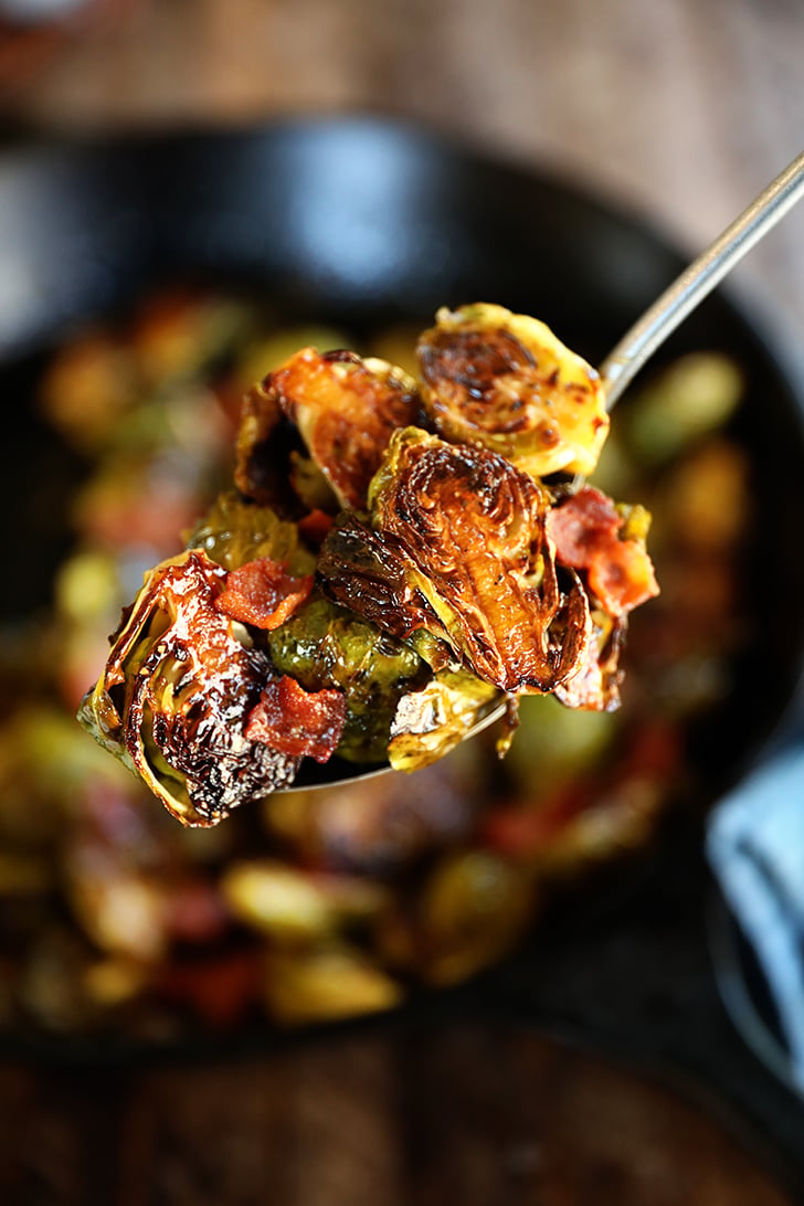 Scoop roasted Brussels sprouts with bacon dressing.