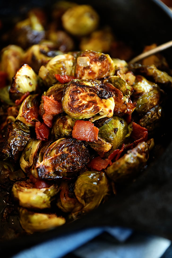 roasted Brussels sprouts with bacon in cast iron skillet.
