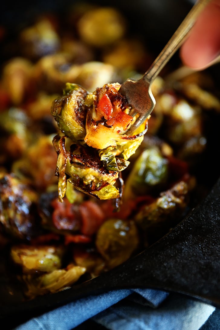 roasted Brussels sprouts with bacon on a fork.