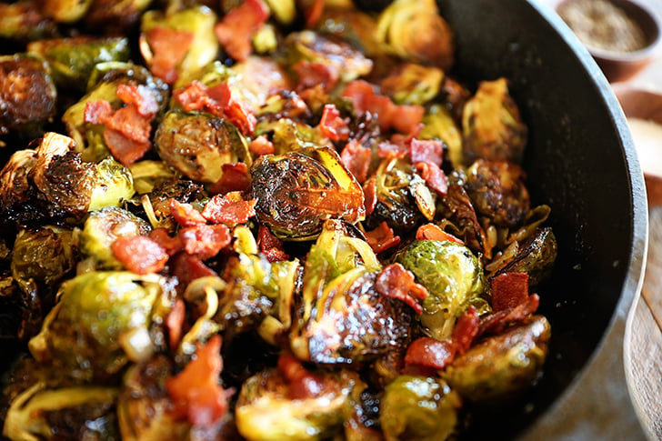 roasted Brussels sprouts with bacon in cast iron skillet.