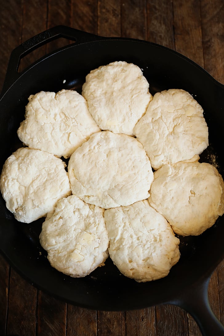 Uncooked biscuits in skillet.
