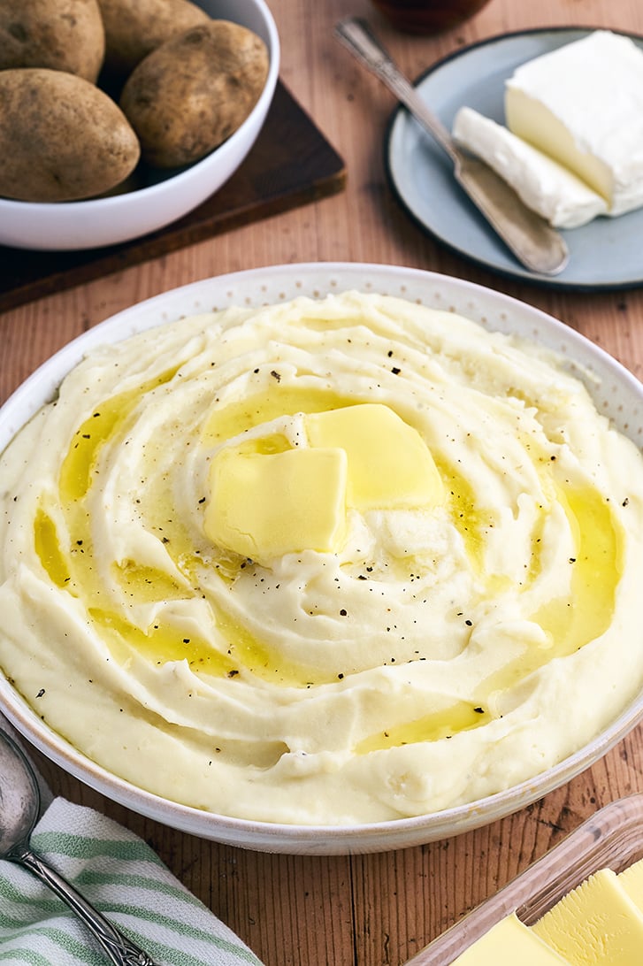 Cream Cheese Mashed Potatoes with butter on top.