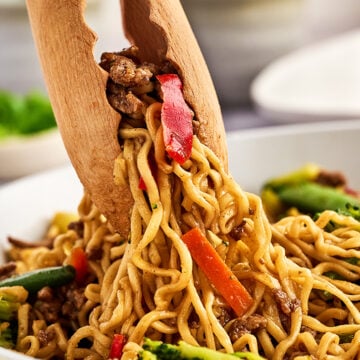 Tongs with ramen.
