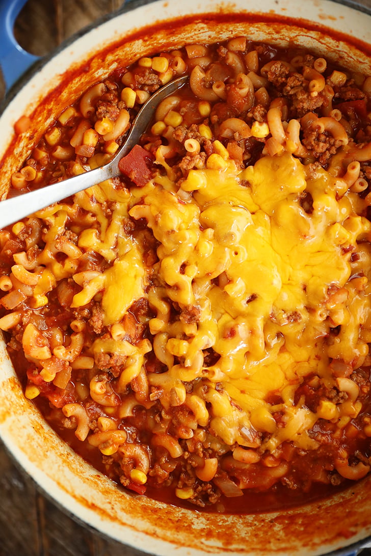 Overhead view of goulash with cheese.