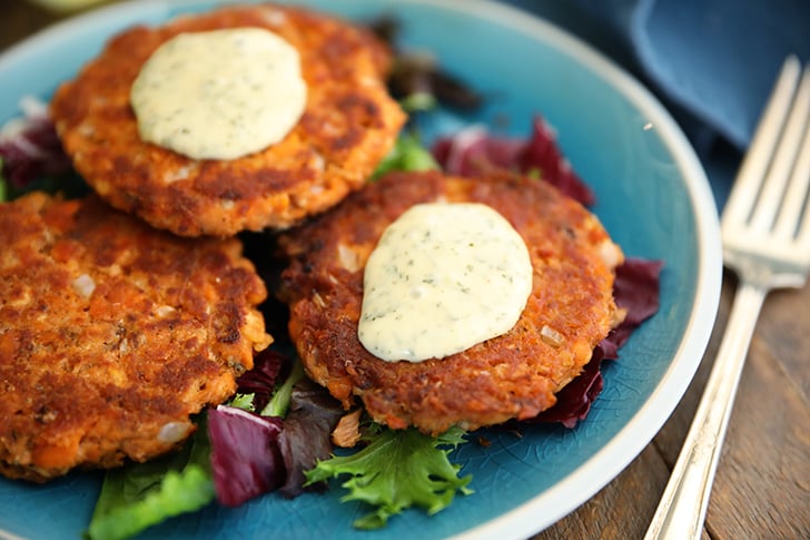 Salmon patties with tartar sauce.