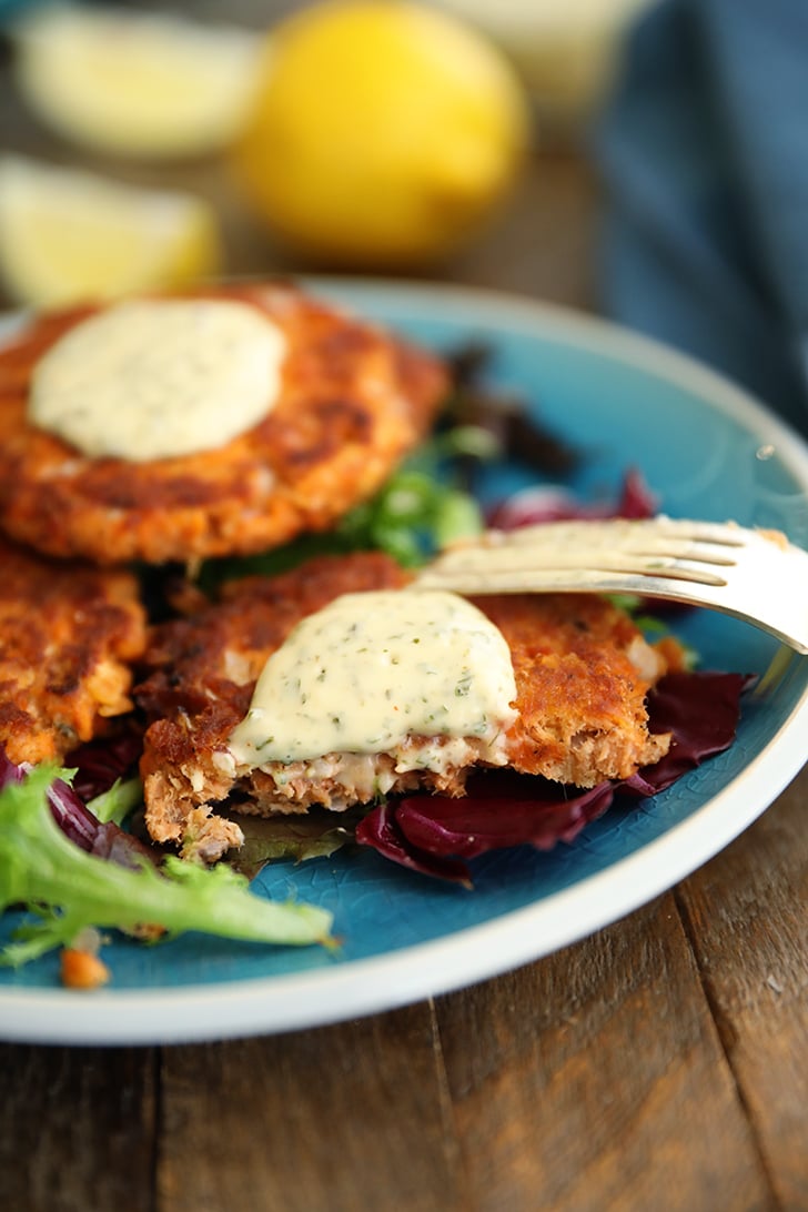 Salmon patties with tartar sauce.