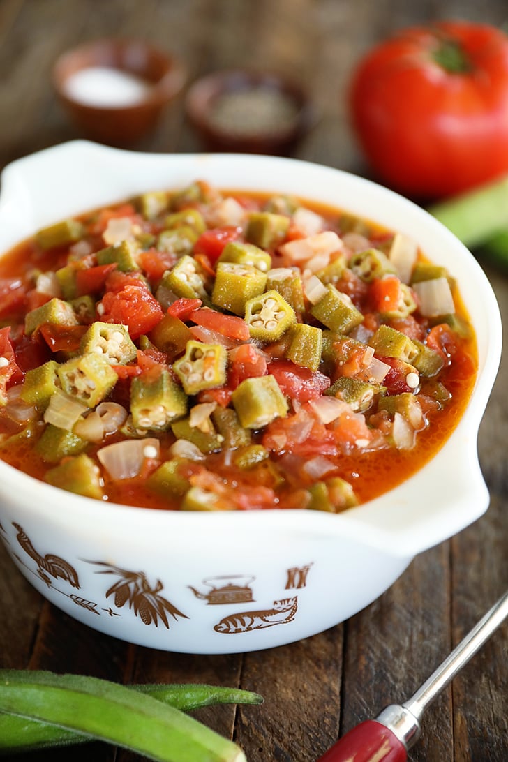 Okra and Tomatoes in a white bowl.