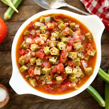 Okra and Tomatoes in a white bowl.