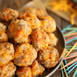 Sausage Balls on a plate with toohpicks.