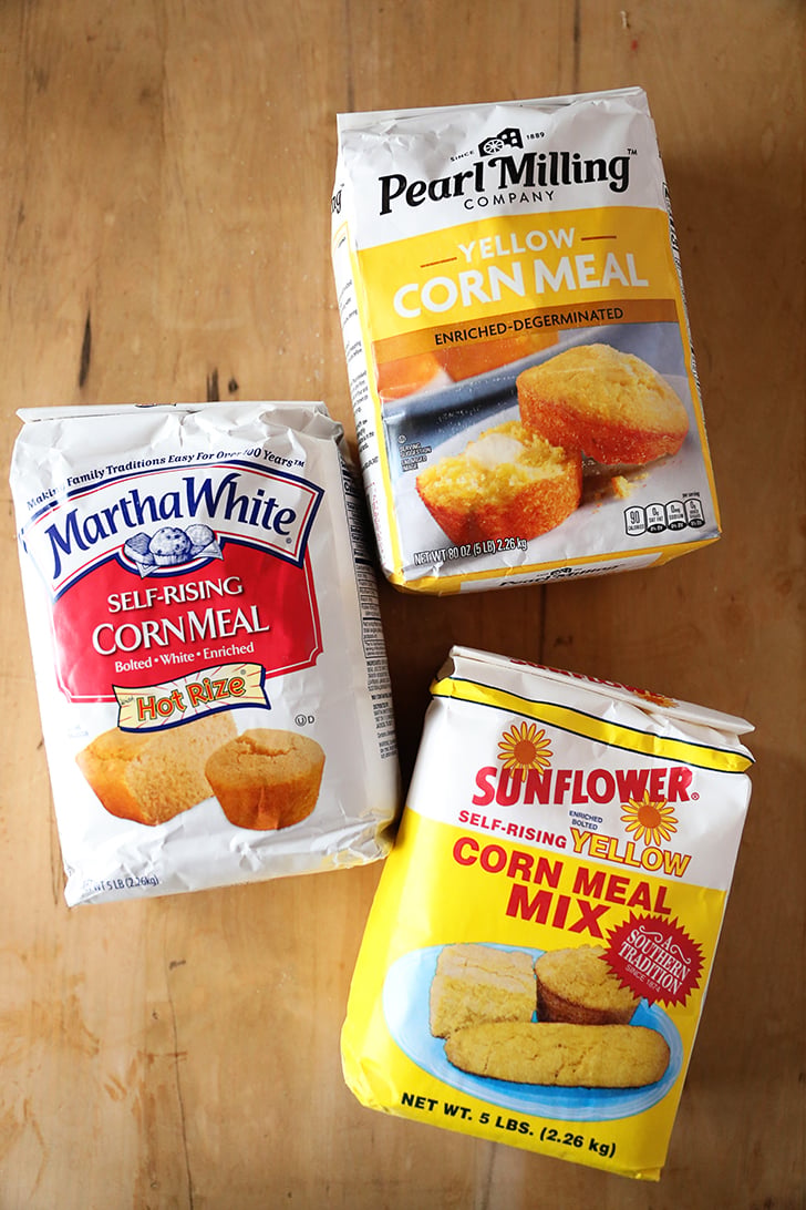 Three bags of different types of cornmeal.