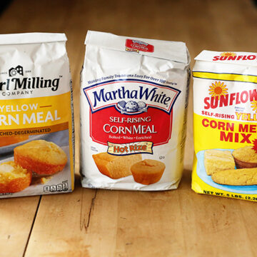 Three bags of different types of cornmeal.