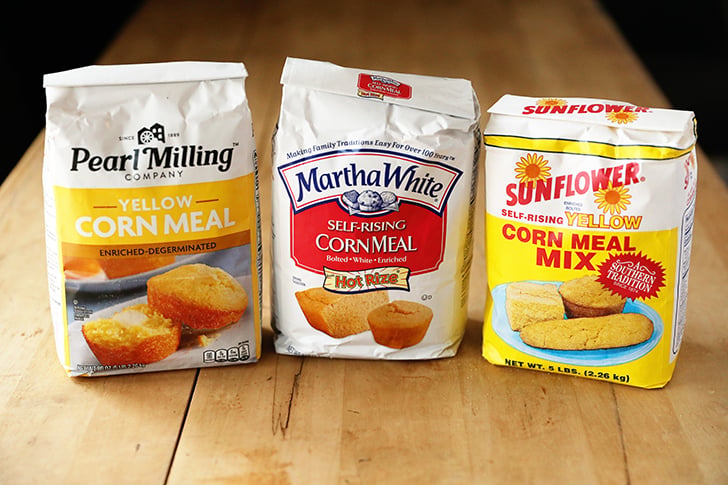 Three bags of different types of cornmeal.