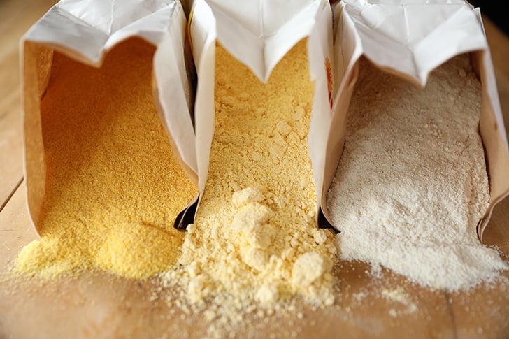 Type of cornmeal spilling out of bags.