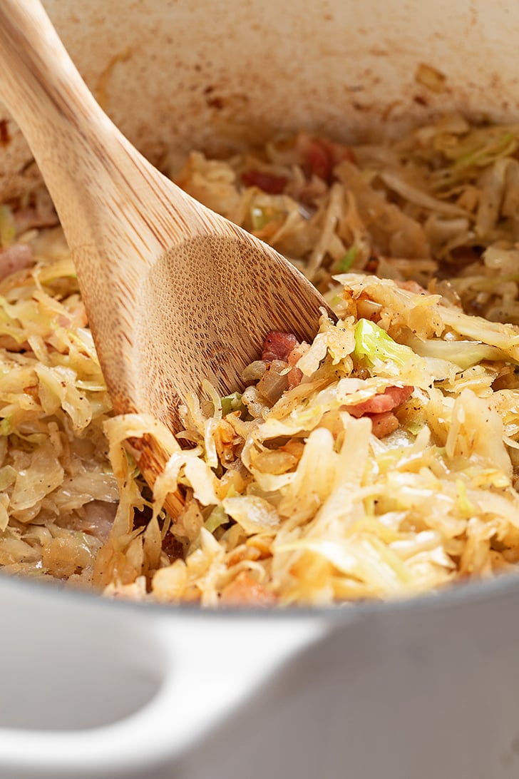 Southern Fried Cabbage and Bacon Served with a Spoon.