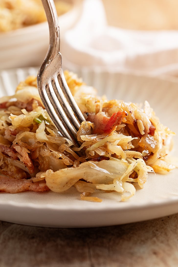 Southern Fried Cabbage and Bacon Being Eaten with a Fork.