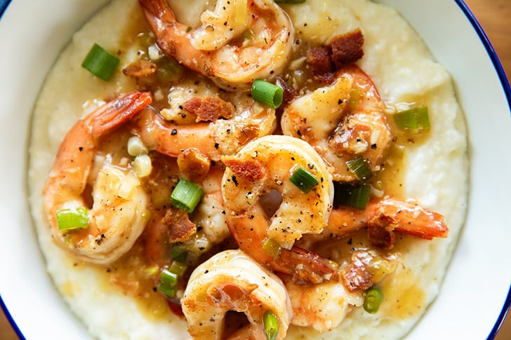 overhead view of shrimp and sauce over grits.