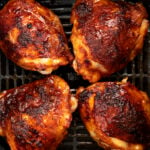 Chicken thighs in an air fryer with hot honey glaze.