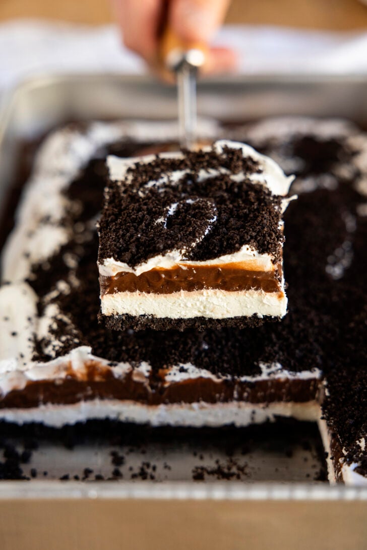 Slice of Oreo Delight on a spatula.