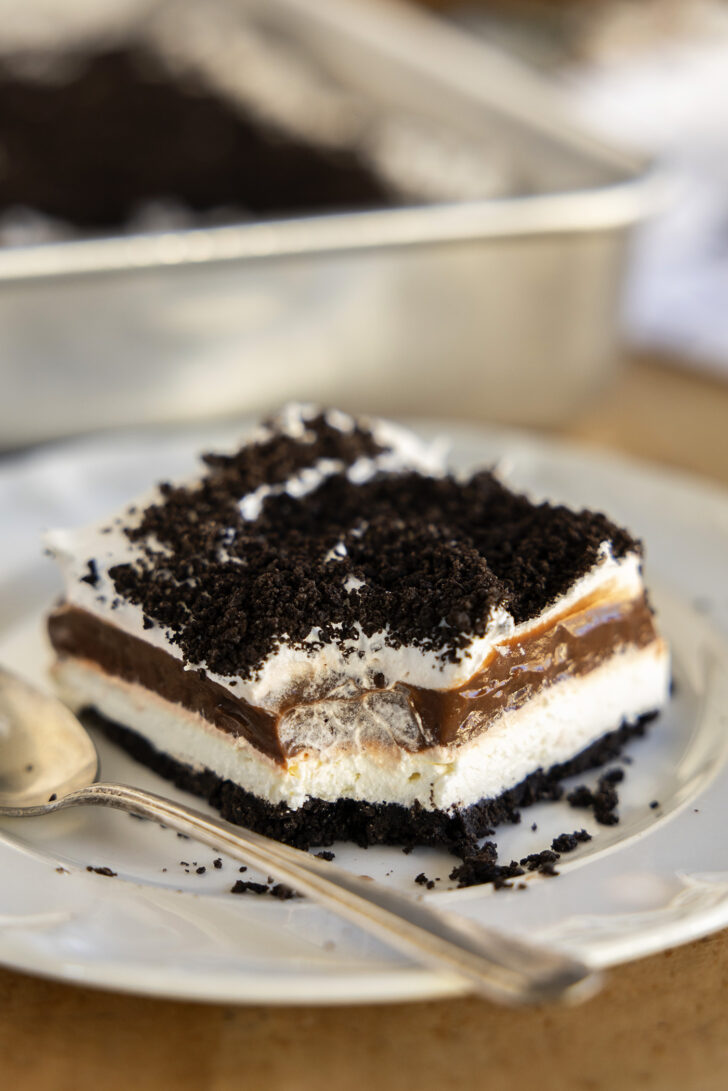 A piece of Oreo Delight with a bite missing.