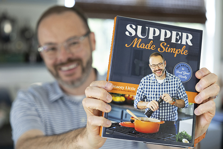 Stacey holding the cookbook.